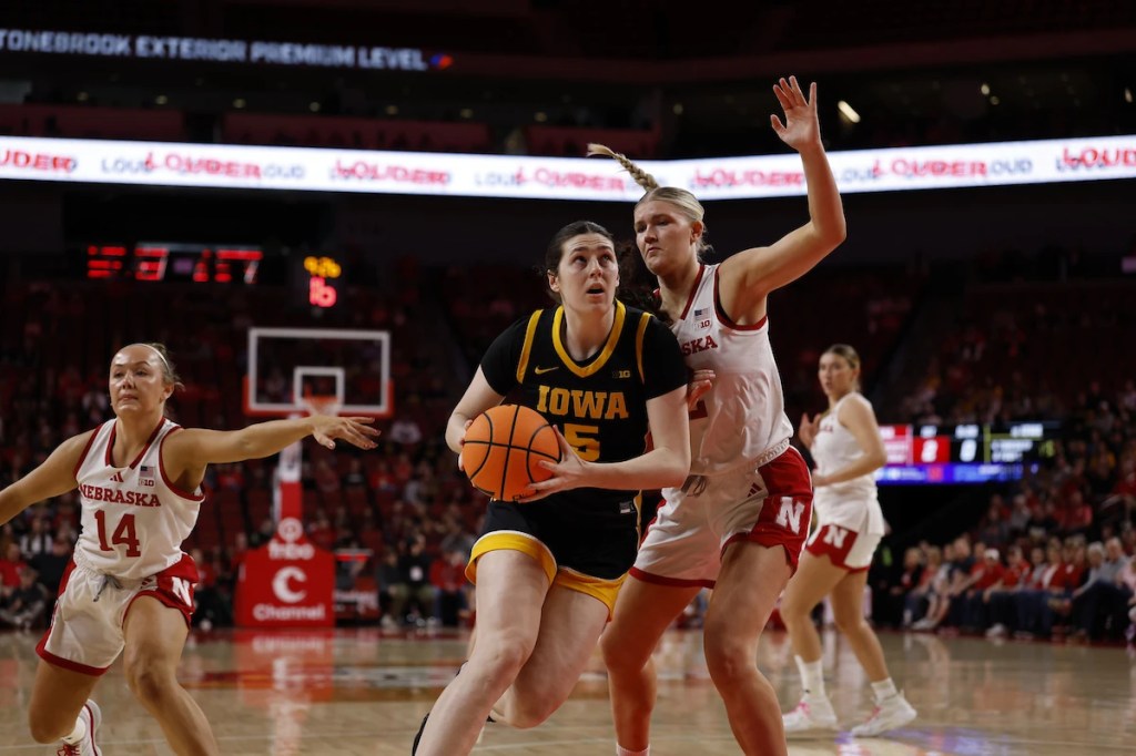 Ava Heiden scores career-high 27 and No. 13 Iowa women beat Nebraska 80-67 for a 20-win season